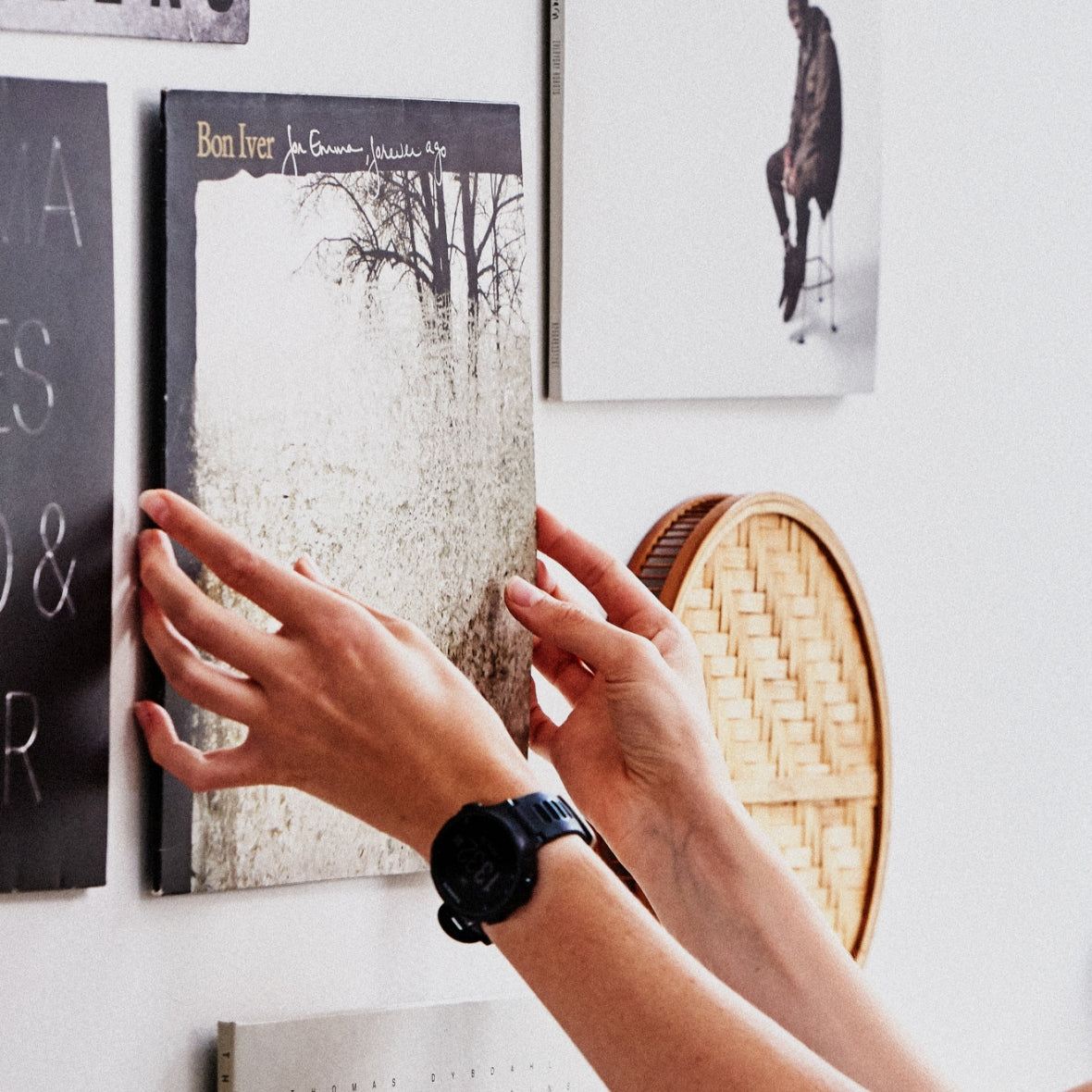 Hands holding a record up against the wall with a Twelve Inch Original