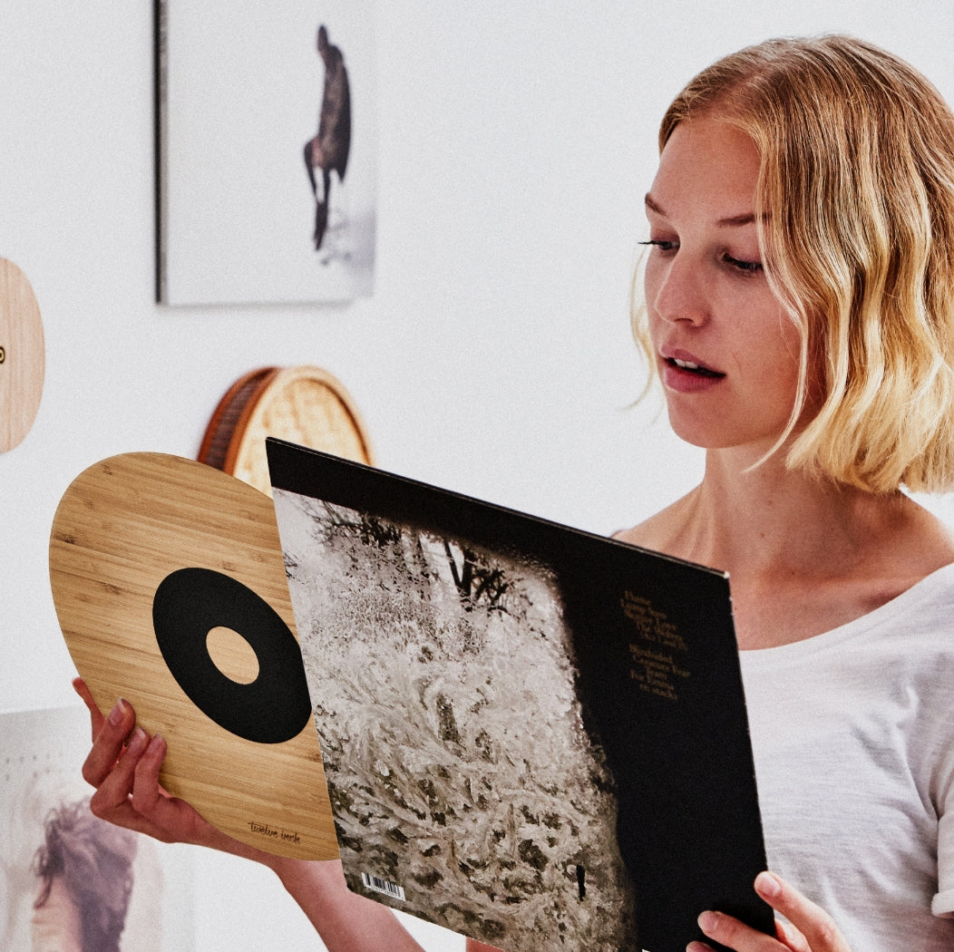 The Twelve Inch Original magnetic disc being inserted into an album cover