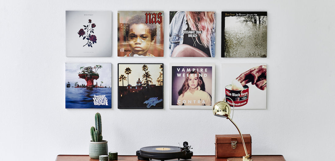Showing eight record albums on the wall