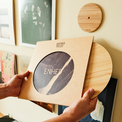 How to slide the thin bamboo disc into the album cover