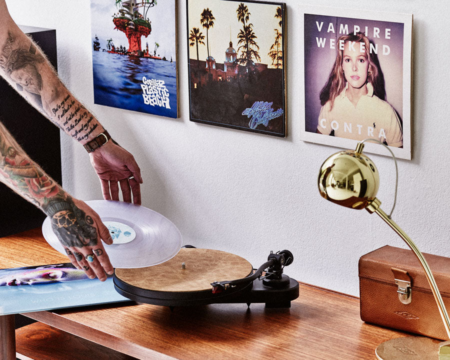 three record on the wall with twelve inch